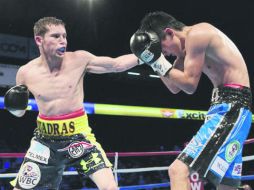 Campeón. Tras la victoria en Japón, Carlos Cuadras (izq.) dejó su récord en 34-0-1 con  26 nocauts. AFP /