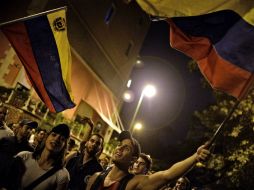 Partidarios de oposición celebran los resultados de las elecciones. AFP / L. Robayo