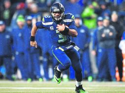 Russell Wilson. El quarterback de los Seahawks lidera la clasificación por rating con 264 pases en 384 intentos durante la temporada. AFP /