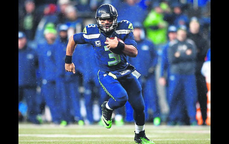 Russell Wilson. El quarterback de los Seahawks lidera la clasificación por rating con 264 pases en 384 intentos durante la temporada. AFP /