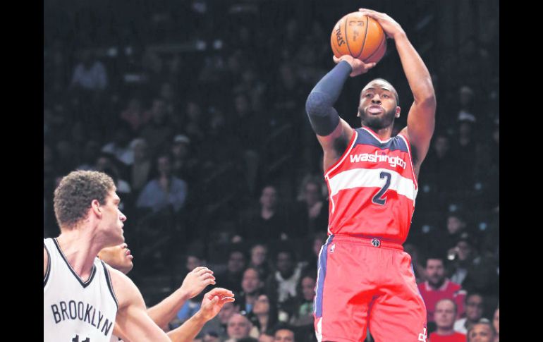 John Wall encabezó la ofensiva de los Wizards al conseguir 22 puntos en su cuenta personal durante el partido frente a los Nets. AP / K. Willens