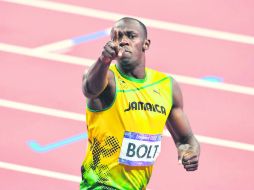 Usain Bolt. Logró el oro en los Mundiales de Beijín en las pruebas de 100 metros, 200 metros y del relevo de los 4 x 100 metros. AP /