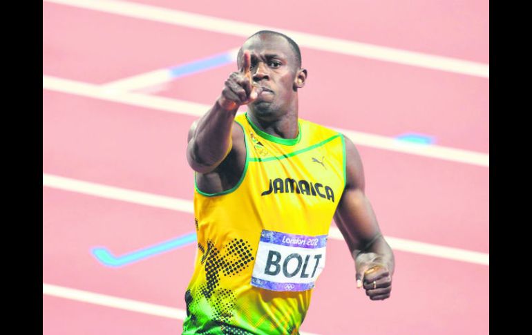 Usain Bolt. Logró el oro en los Mundiales de Beijín en las pruebas de 100 metros, 200 metros y del relevo de los 4 x 100 metros. AP /