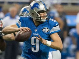 Matthew Stafford lanzó para dos anotaciones, incluido un pase a Calvin Johnson en el cuarto periodo. AFP / D. Reginek