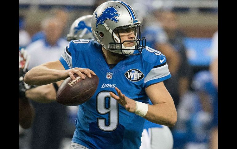 Matthew Stafford lanzó para dos anotaciones, incluido un pase a Calvin Johnson en el cuarto periodo. AFP / D. Reginek