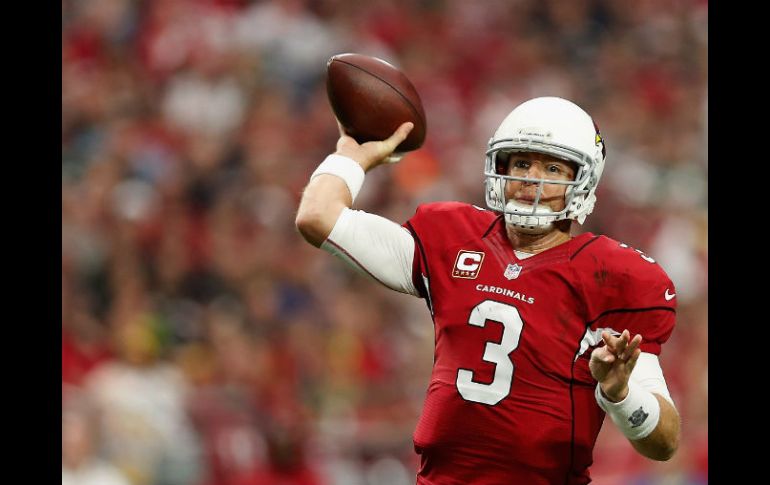 Carson Palmer lanzó para generar 257 yardas y dos anotaciones por Arizona. AFP / C. Petersen