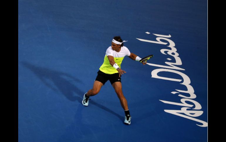 Nadal estrena el año con una victoria ante su compatriota Ferrer. AFP / K. Sahib