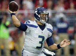 Russell Wilson lanzó tres pases de anotación durante una magistral exhibición ofensiva en la primera mitad. AFP /  R. Franklin