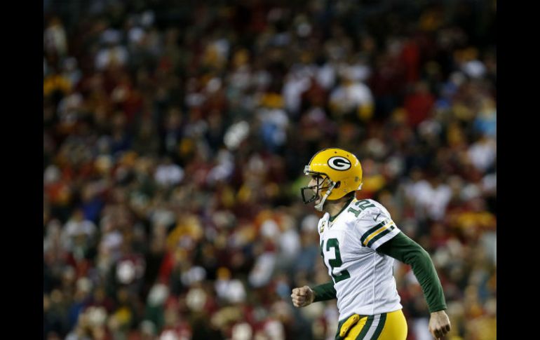 Green Bay remontó una desventaja de 0-11 tras el primer cuarto con par de pases anotadores de Aaron Rodgers. AFP / R. Carr