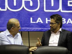 Las FARC y gobierno cierran parcialmente cuatro de los seis puntos de la negociación; queda por definir el desarme de la guerrilla. EFE / E. Mastrascusa