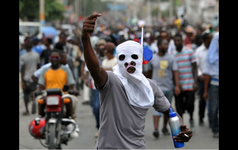 Las manifestaciones son 'un golpe de Estado electoral', se alega que están arregladas para que gane Jovenel Moise, oficialista. AFP / H. Retamal