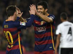 Luis Suárez anotó cuatro goles y Leo Messi tres. AFP / L. Gene