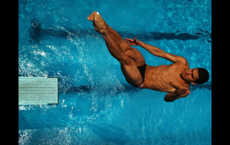 Rommel Pacheco, campeón del mundo, competirá en la prueba individual de trampolín de tres metros. AFP / ARCHIVO