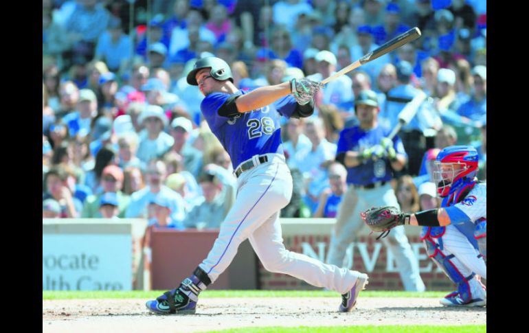 Nolan Arenado encabeza el apartado de carreras impulsadas, además de conseguir nueve hits y cuatro jonrones. AFP / D. Buell