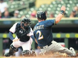 Target Field. Scooter Gennett conectó el sencillo remolcador que le dio el triunfo a Milwaukee. AFP / H. Foslien