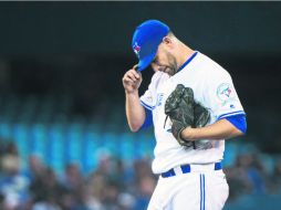 Marco Estrada. El abridor mexicano de los Azulejos cargó con la derrota en el partido de ayer. AP / N. Denette