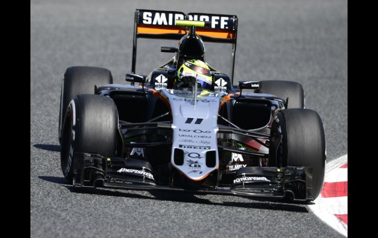 ''Espero seamos fuertes en la carrera, tenemos una buena posición en la pista'', dice Sergio. AFP / T. Gandolfini