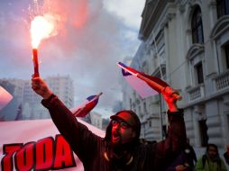 Lo que empezó como una marcha pacífica, a la mitad de su transcurso se convirtió en varios focos de incidentes. AP / E. Felix