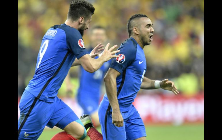 Los goles de los bleus fueron de Dimitri Payet y Olivier Giroud (izq). AP / M. Meissner