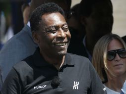 Pelé estaba entusiasmado con la apertura y afirmó que es un honor poder estar en representación de Hublot. AFP / P. Kovarik