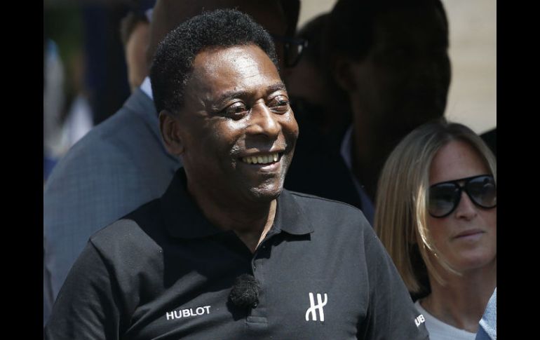 Pelé estaba entusiasmado con la apertura y afirmó que es un honor poder estar en representación de Hublot. AFP / P. Kovarik