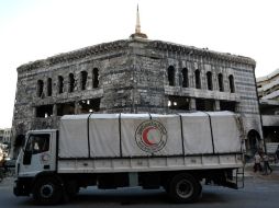 Un total de 31 camiones con comida para 14 mil 200 familias accedieron al lugar, de parte de la Cruz Roja y la Media Luna Roja Siria. AFP / S. Al-Doumy