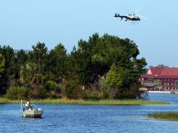 La Comisión para la Conservación de la Fauna y la Pesca (FWC) mantiene el rastreo del terreno y la laguna Seven Seas. AP / R. Huber