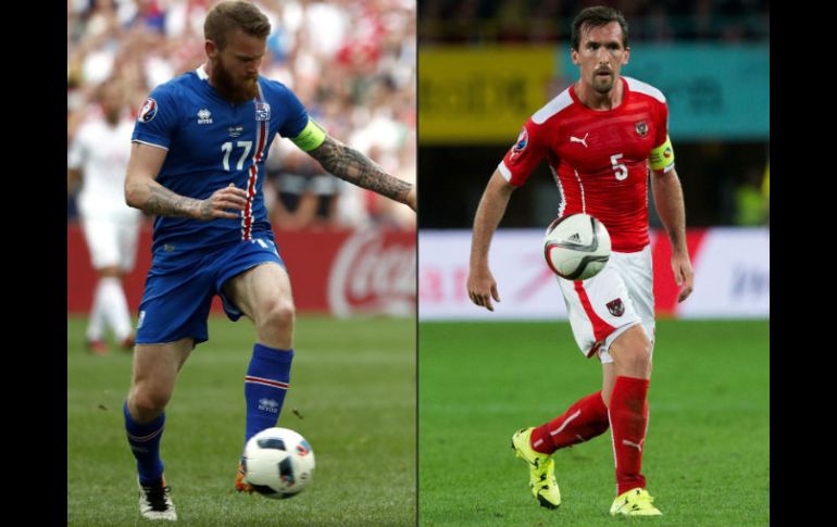 Aron Gunnarsson de Islandia (I) y Christian Fuchs (D) de Austria son referentes en este partido de futbol. AFP / O. Andersen