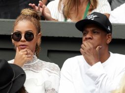 Beyoncé acompañada de su marido, el rapero Jay-Z durante la final del torneo. AP / A.Davy