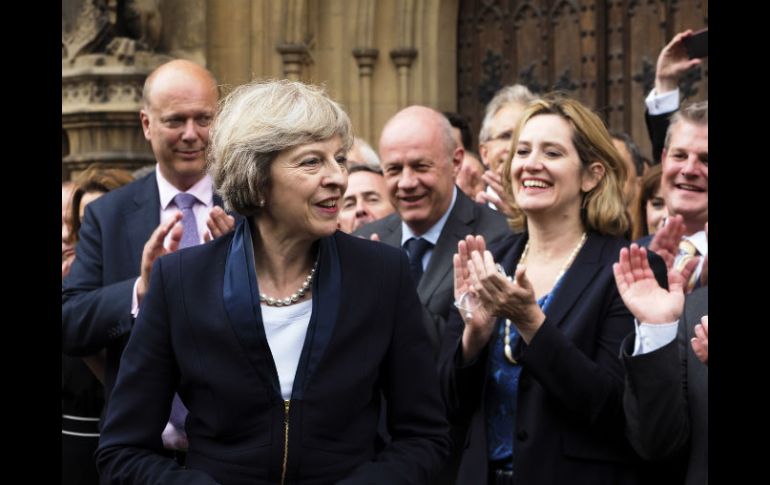 Brexit” significa Brexit, y vamos a hacerlo con éxito, declara May en las afueras del Parlamento británico. AP / M. Nash