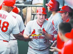 Festejo. El antesalista Jedd Gyorko (#3) pegó de vuelta entera en el triunfo de los Cardenales de San Luis. AP /