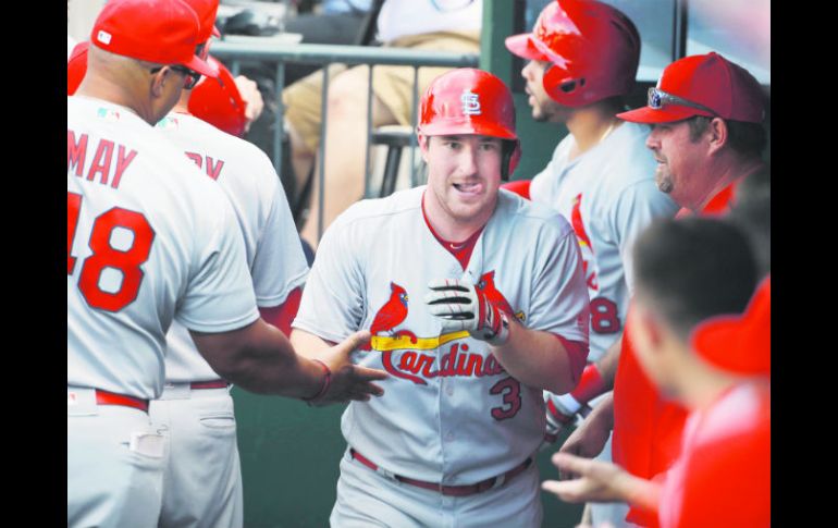 Festejo. El antesalista Jedd Gyorko (#3) pegó de vuelta entera en el triunfo de los Cardenales de San Luis. AP /