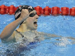 La prodigiosa nadadora, que dominó de principio a fin la prueba, paró el cronómetro a los 3:56.46 minutos. AP / M. Meissner