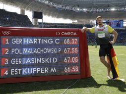 Christoph Harting, Daniel Jasinski y Piotr Malachowski comparten el podio de los Juegos Olímpicos. AP / M. Slocum