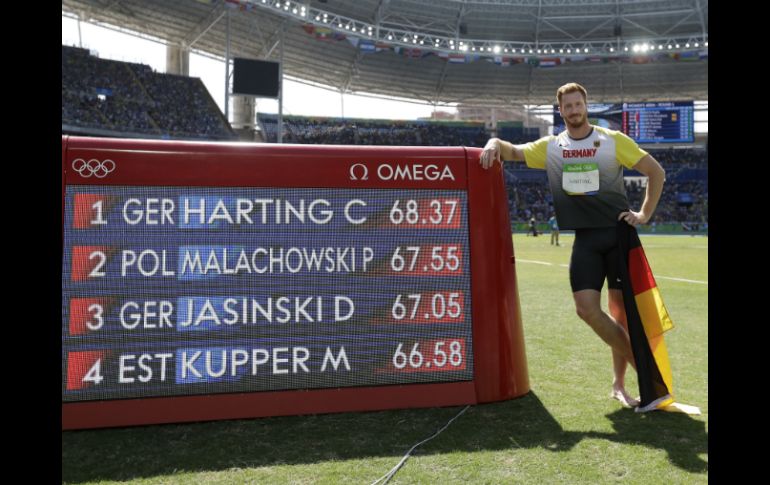 Christoph Harting, Daniel Jasinski y Piotr Malachowski comparten el podio de los Juegos Olímpicos. AP / M. Slocum