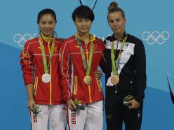 Tingmao Shi (c), subcampeona en Londres 2012, acumuló la mejor puntuación durante los cinco saltos. AP / W. Maye-E