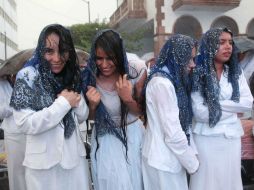 La tormenta de ayer no fue capaz de mover a los fieles de la Luz del Mundo, en la celebración de la Santa Cena. EL INFORMADOR / M. Vargas