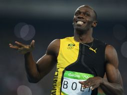 Bolt cautiva al público con su sonrisa y su show antes de cada salida. AFP / J. Eisele