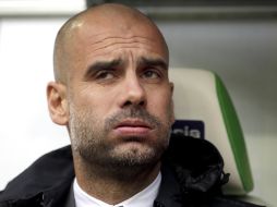 ''No hablando de Joe, sino de todos los jugadores en la escuadra, quiero vivir y trabajar con los que quieren quedarse'', advierte Pep. AP / ARCHIVO