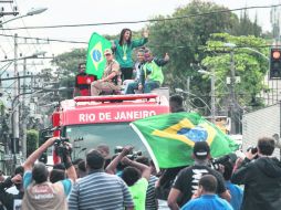 La judoka brasileña Rafaela Silva desfiló por calles de la favela “Ciudad de Dios” portando su medalla de oro. AFP / Y. Chiba