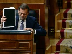 Rajoy logró hoy 170 votos, procedentes de su partido, contra 180 del partido socialista y coaliciones de izquierda. AFP / P. Marcou