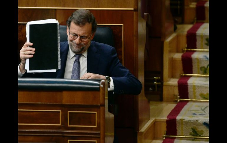 Rajoy logró hoy 170 votos, procedentes de su partido, contra 180 del partido socialista y coaliciones de izquierda. AFP / P. Marcou