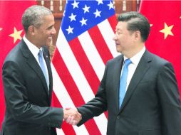 Compromiso. Barack Obama y Xi Jinping se saludan previo a la reunión del G-20. AFP /