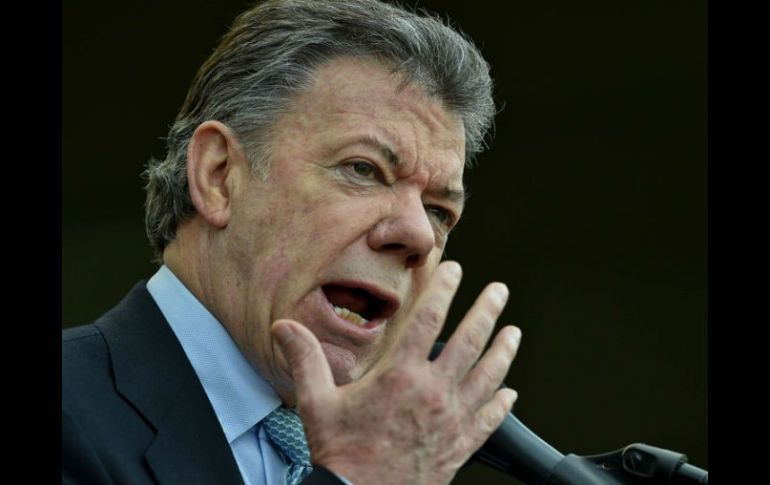 Santos admite que el proceso de negociación ha sido difícil; pese a ello, el acuerdo cambiará la historia de Colombia. AP / ARCHIVO