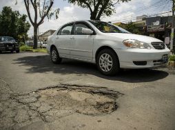 Las autoridades de Zapopan reciben hasta 800 reportes de baches al día. EL INFORMADOR / ARCHIVO