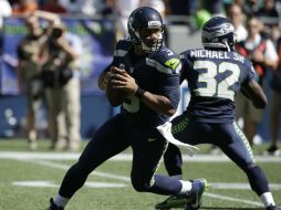 Aun aquejado por una lesión de tobillo, Russell Wilson logró otra remontada. AP / E. Thompson