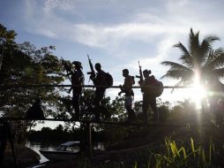 Antes de reincorporarse a la sociedad, los guerrilleros se concentrarán en más de una veintena de puntos para entregar armas. AP / ARCHIVO