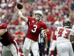 Carson Palmer lanzó para 308 yardas y tres touchdowns. AP / R. Franklin