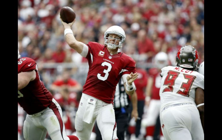 Carson Palmer lanzó para 308 yardas y tres touchdowns. AP / R. Franklin