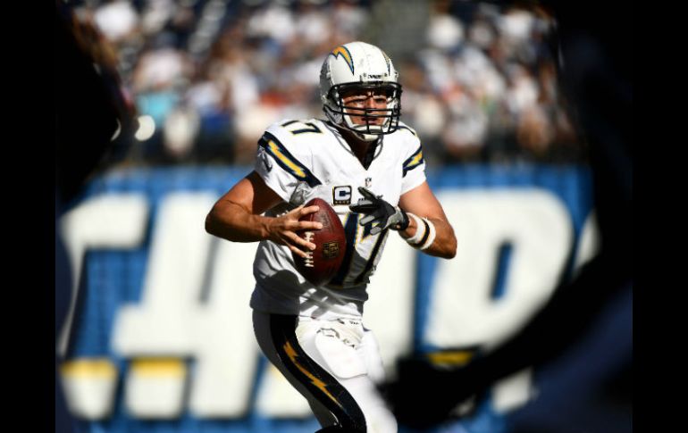 Philip Rivers igualó la mejor marca de su carrera al lanzar cuatro pases de anotación. AFP / D. Miralle